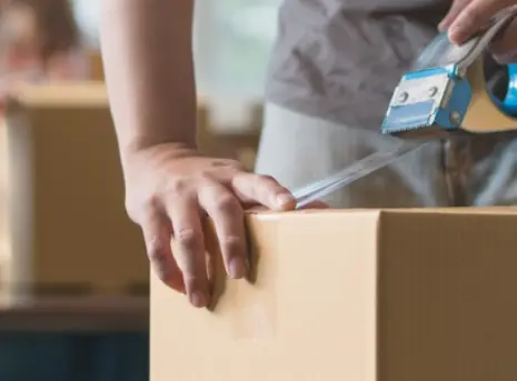 why-colorado-movers-featured-mobile A professional mover packing up boxes for a move
