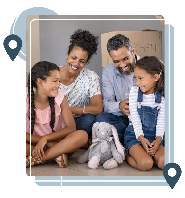 Family with two children smiling together during a move in Colorado Springs.