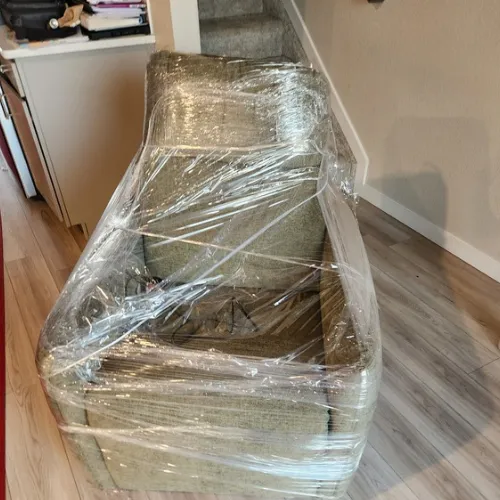 Furniture securely wrapped and protected by Fatboy Slims Moving Company.