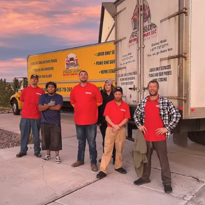 Fatboy Slims Moving team standing beside their moving trucks in Colorado.
