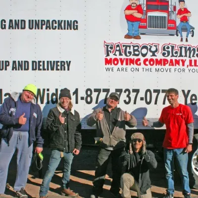 Fatboy Slims Moving Company crew posing in front of a moving truck.