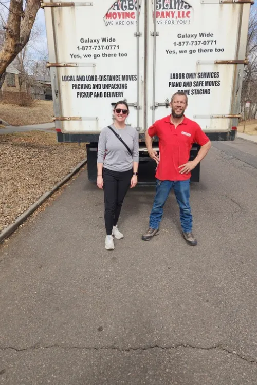 Fatboy Slims Moving Company team standing in front of a branded moving truck.